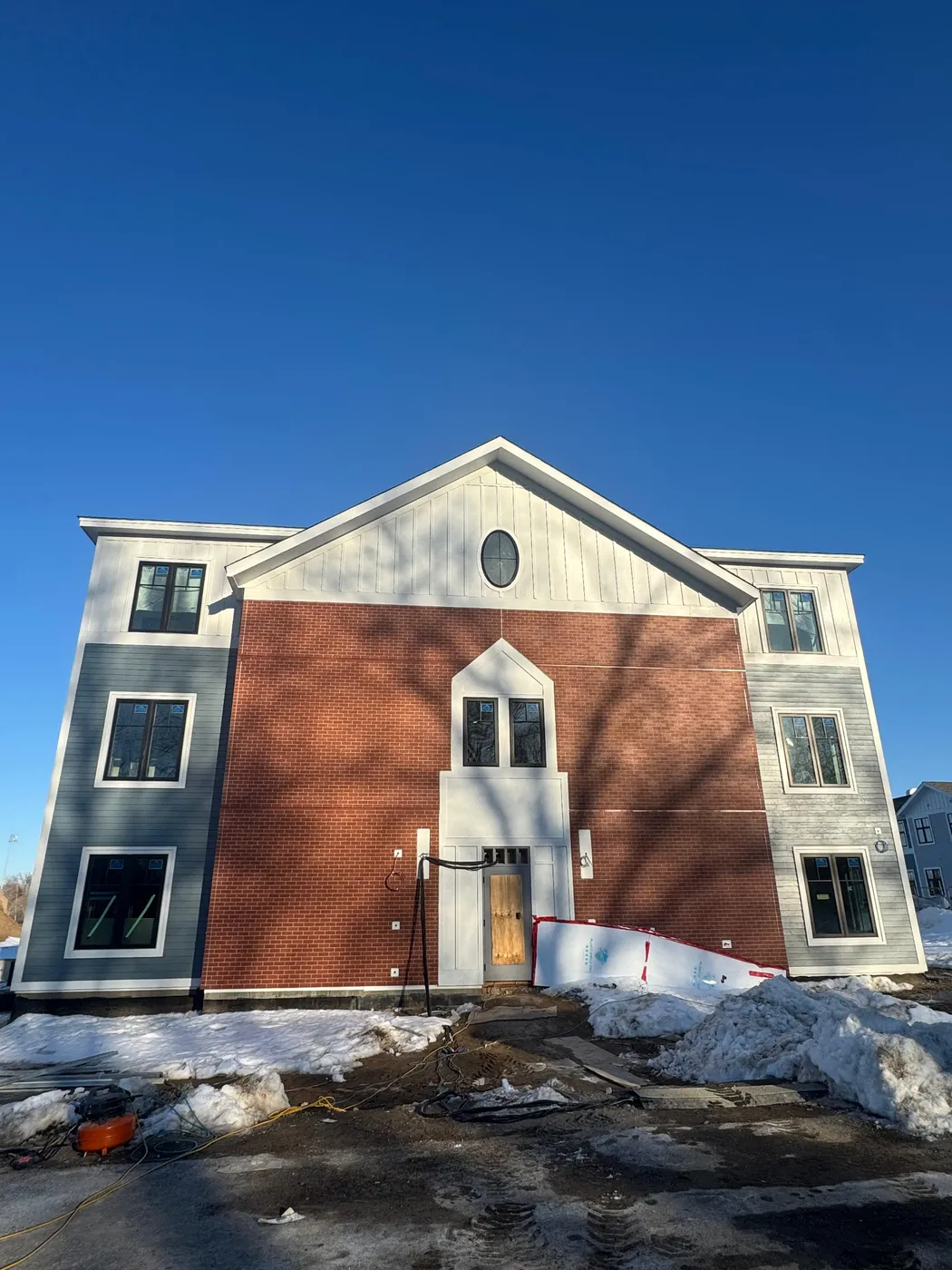 New siding and trim on a multifamily exterior