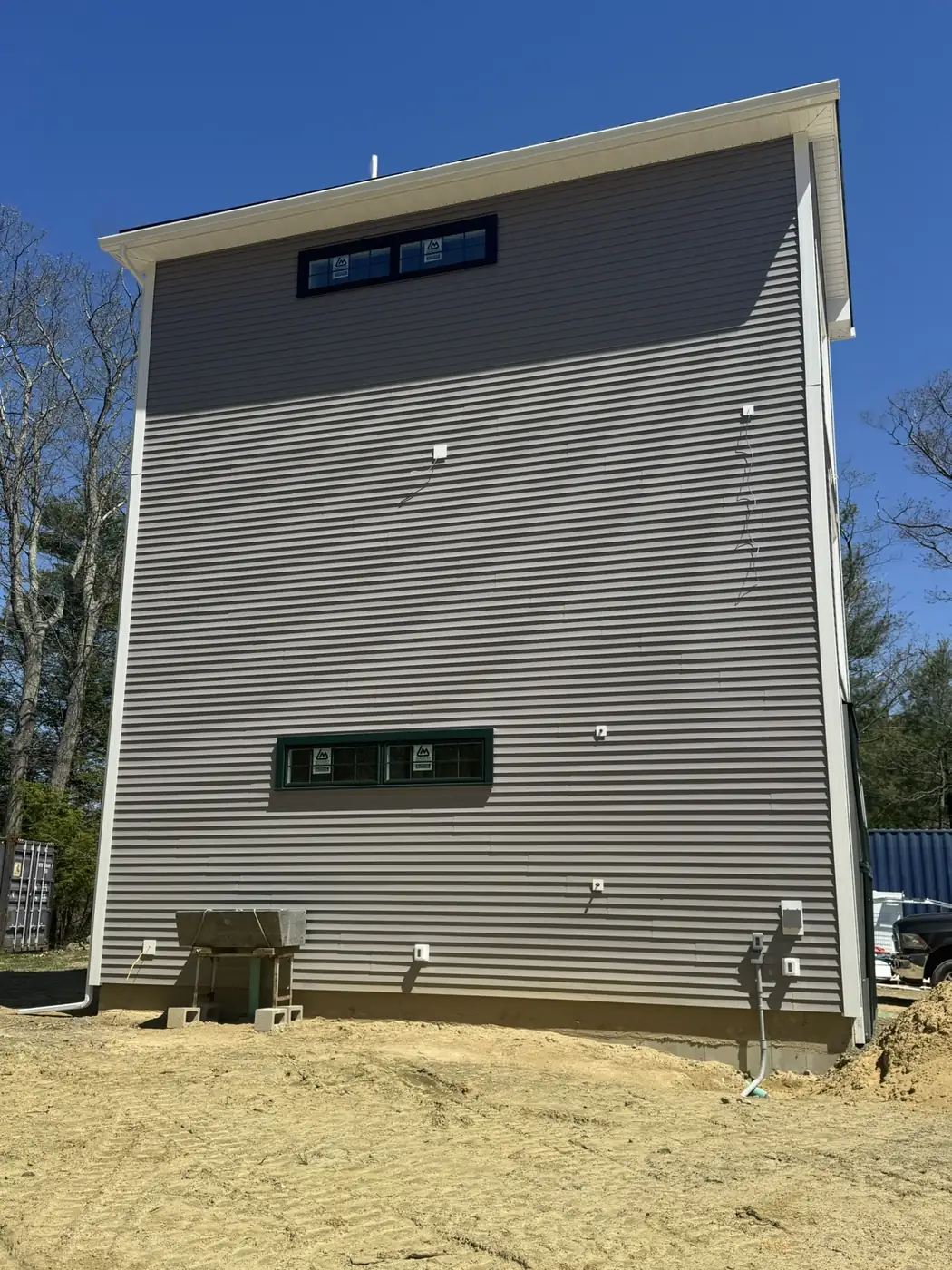 Exterior siding on a tall garage build