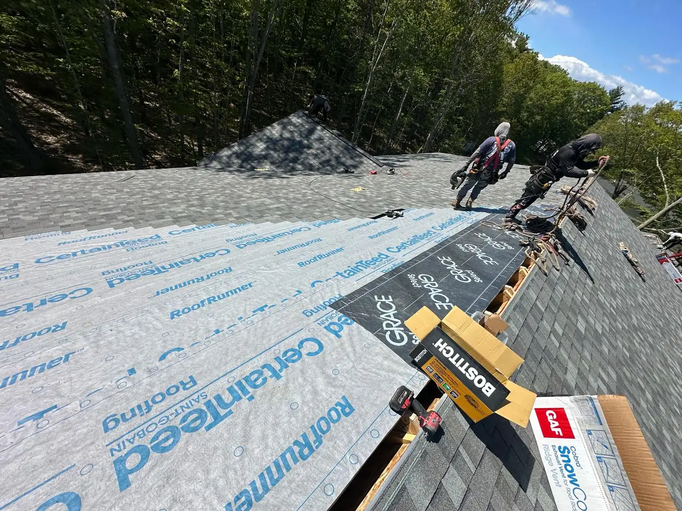 Shingle roof installation in progress