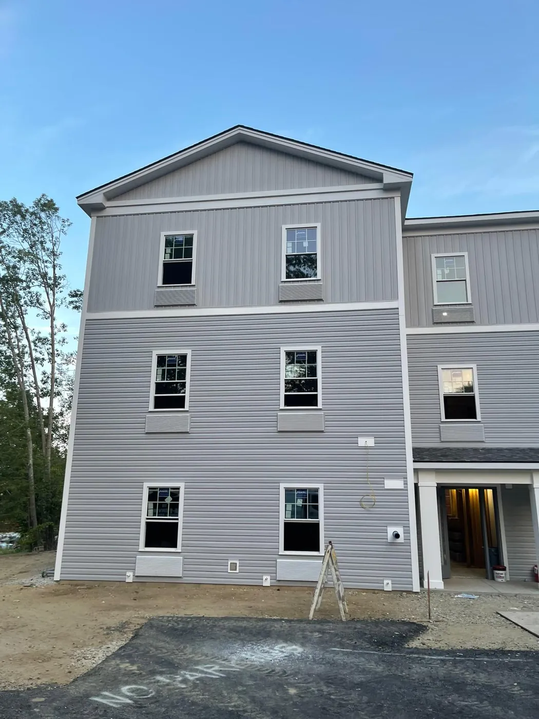 Exterior of a multi unit building after siding