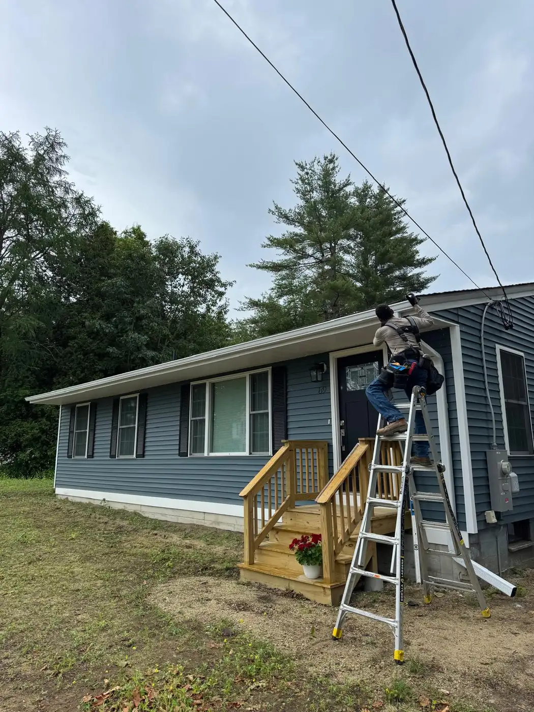 Seamless gutter installation on a residential roofline